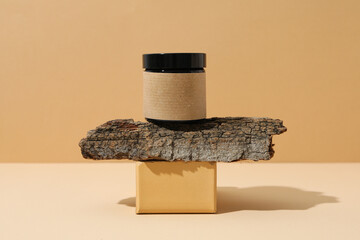 Cosmetic oil in a jar with tree bark