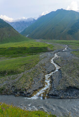 A stream flowing from the mountains flows into the Terek River.