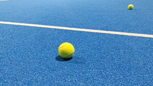 Ukraine Kyiv, April 11 2024: Padel racket adidas and padel ball on a green court 