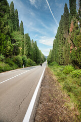 Tuscany, Italy. Asphalt line in nature, panoramic road to travel destination