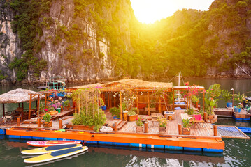 Floating fishing village in sea bay in Vietnam, boats and islands © Maresol