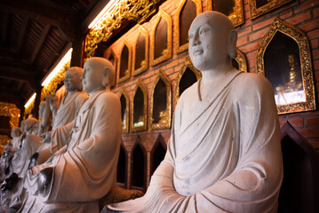 Many Buddha statues in a hindu pagoda in Vietnam