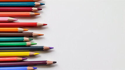 Fototapeta premium Colorful Pencil Set Arranged on White Background