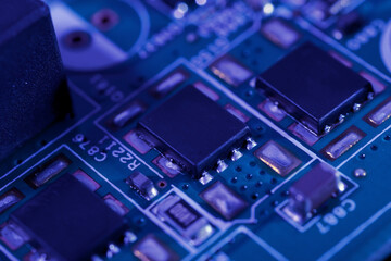 Close-up view of an integrated circuit mounted on a green printed circuit board.