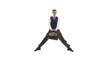 Happy smiling man in formal wear, employee, office worker jumping with briefcase isolated on white...
