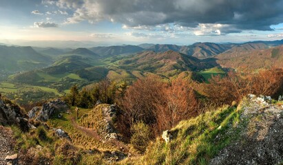 Rock and forest at spring in Slovakia. View from the top of The Vapec hill in The Strazov Mountains. Seasonal natural scene.