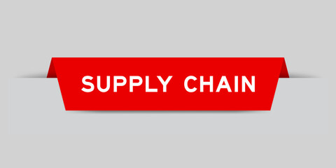 Red color inserted label with word supply chain on gray background