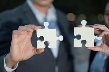 Business partnership concept with connecting puzzle pieces