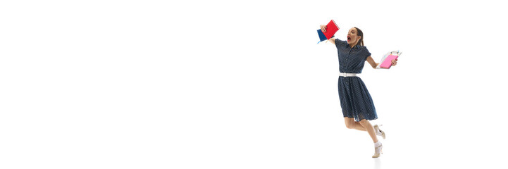 Emotional woman, office worker, employee with notes and documents emotionally running, being late isolated on white background. Concept of business, office lifestyle, entrepreneurship