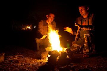 by the fire outdoors