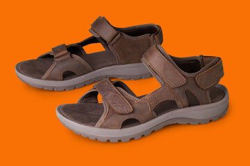 Hike sandal in leather on orange background