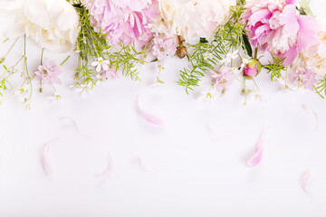 Wedding invitation or Mother's Day background, empty space with pink peony flowers, top view flat lay.