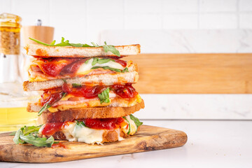 Grilled Pizza Sandwich, cheese pizza burger with tomatoes, tomato sauce, bacon, pepperoni salami, arugula, copy space