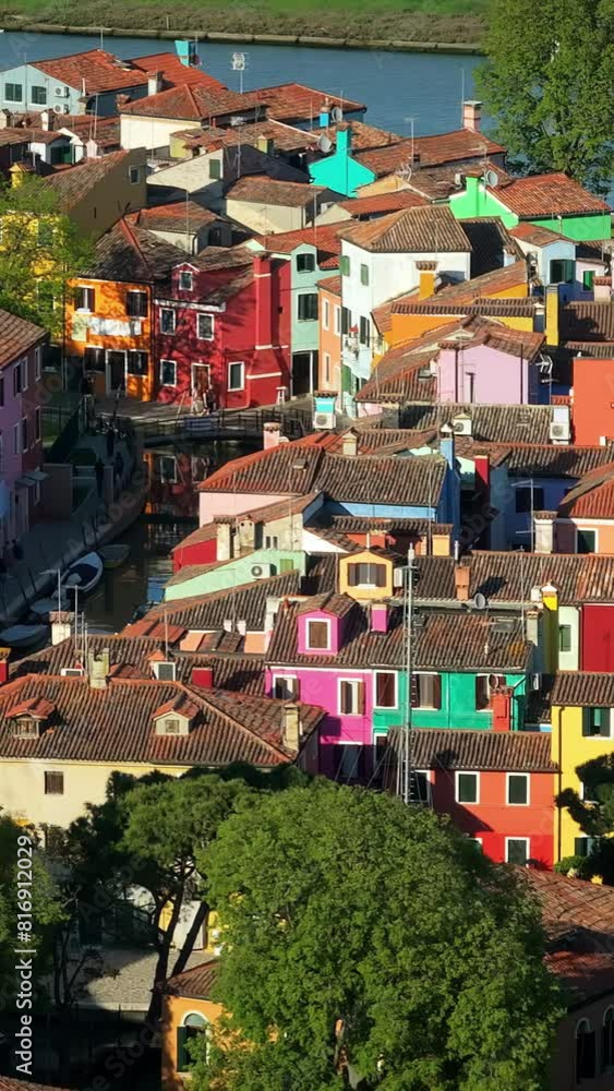 Wall mural Aerial drone view of the colourful houses of Burano Island, Italy. Vertical