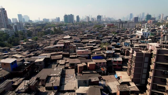 Aerial view flying over the Dharavi slums in Mumbai, Maharashtra, India. Dharavi is considered to be one of the largest slums in the world and the largest in Asia