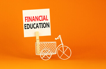 Financial education symbol. Concept words Financial education on beautiful white paper on wooden...