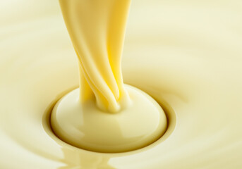 white chocolate pouring.