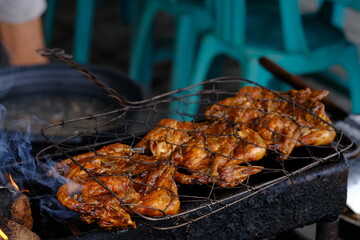 ayam bakar Taliwang is Taliwang grilled chicken is a typical food of Lombok and Sumbawa, West Nusa Tenggara. Spicy shrimp paste chicken. Indonesian food. 