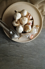 Close-up of garlic and seashells on table