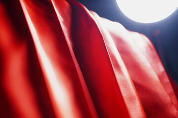 red satin backdrop There are lights to provide brightness. (blurred or blurry)