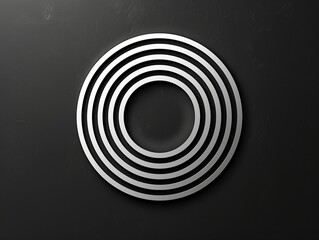 Fototapeta premium A sleek and modern circular design with concentric rings on a dark textured background, representing balance and unity in minimalistic style
