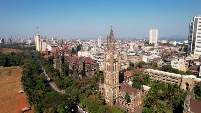 Rajabai Clock Tower in Mumbai, India, Colaba district, Aerial view. Victorian architecture in India. 1878 clock tower modeled after Big Ben
