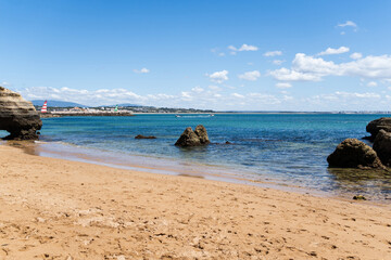 Praia dos Estudantes beach in Lagos, Algarve, Portugal. Sunny day, crystal clear and blue sea. Student beach