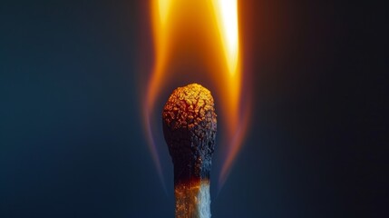 Macro shot of a freshly ignited matchstick, the tip ablaze with a strong, bright flame, highlighting the power of fire