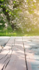 Springtime Serenity: Light Pastel Pink Table With Blooming Meadow Background for Product Montage