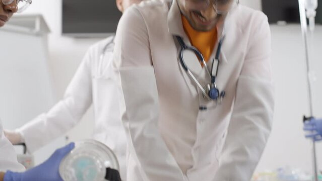 CPR training in medical clinic. Slow motion