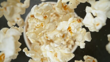 Popcorn falling on bucket, top down shot