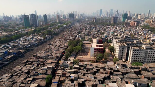 Aerial view flying over the Dharavi slums in Mumbai, Maharashtra, India. Dharavi is considered to be one of the largest slums in the world and the largest in Asia