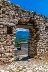 A view through a doorway in the castle above the city of Berat, Albania in summertime