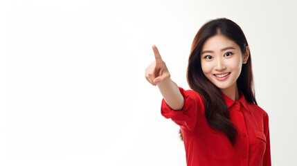 Photo of a young Asian woman in a red shirt smiling and pointing to the right.