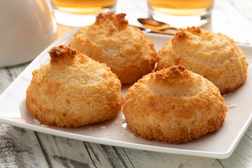 Plate with traditional homemade baked coconut cookies close up