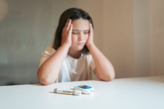 Young girl feeling unwell due to hypoglycemia symptoms