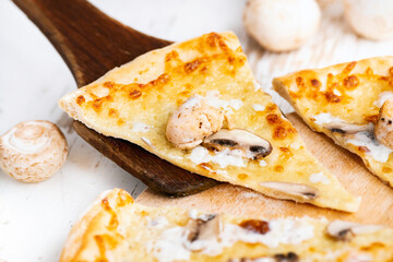 Tasty fresh baked pizza with champignons and chicken fillet