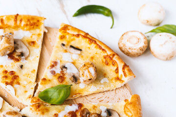 Tasty fresh baked pizza with champignons and chicken fillet