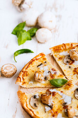 Tasty fresh baked pizza with champignons and chicken fillet