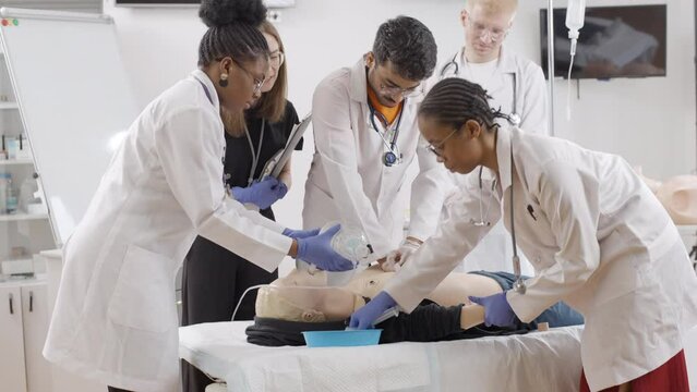 Lifelike learning: foreign medical students mastering first aid on a mannequin
