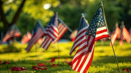 A patriotic display of American flags fluttering in the wind at a Memorial Day ceremony. 