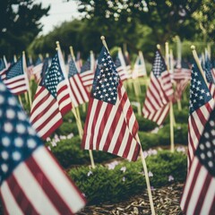 A patriotic display of American flags fluttering in the wind at a Memorial Day ceremony. 