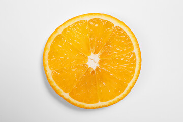 Slice of juicy orange on white background, top view