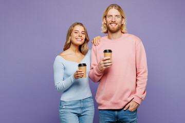 Young couple two friends family man woman wear pink blue casual clothes together hold takeaway...