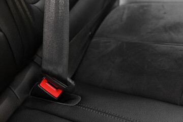 Safety belt and seat inside of modern black car, closeup