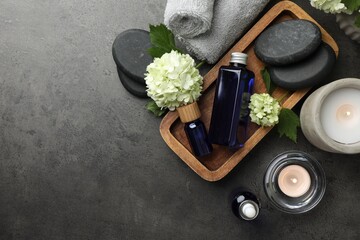 Flat lay composition with spa products on gray table, space for text