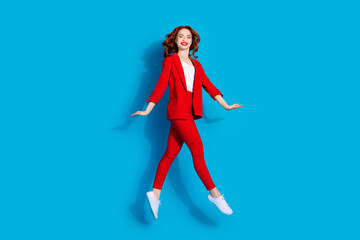 Photo of stunning gorgeous nice girl wear red stylish clothes fly air isolated on blue color...