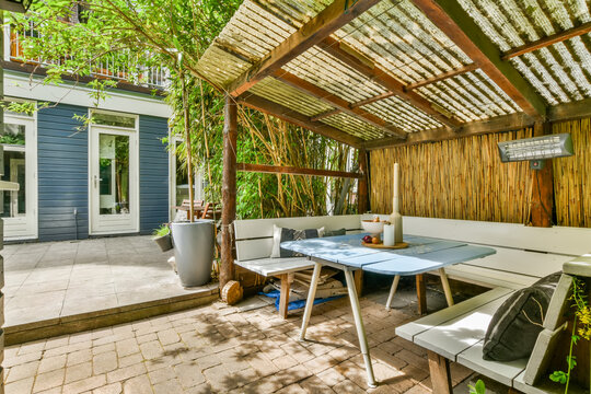 Cozy Patio Area with Pergola and Comfortable Seating