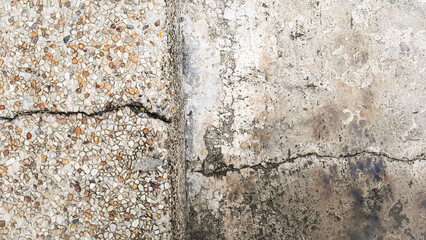 Cracks in the edges of adjacent stone and cement floors It is a crack that runs horizontally and horizontally on an old and used surface.