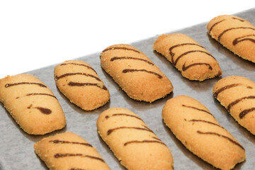 Kue lidah kucing or cat's tongue cookies. traditional cookies for eid holiday in indonesia. kue lebaran.